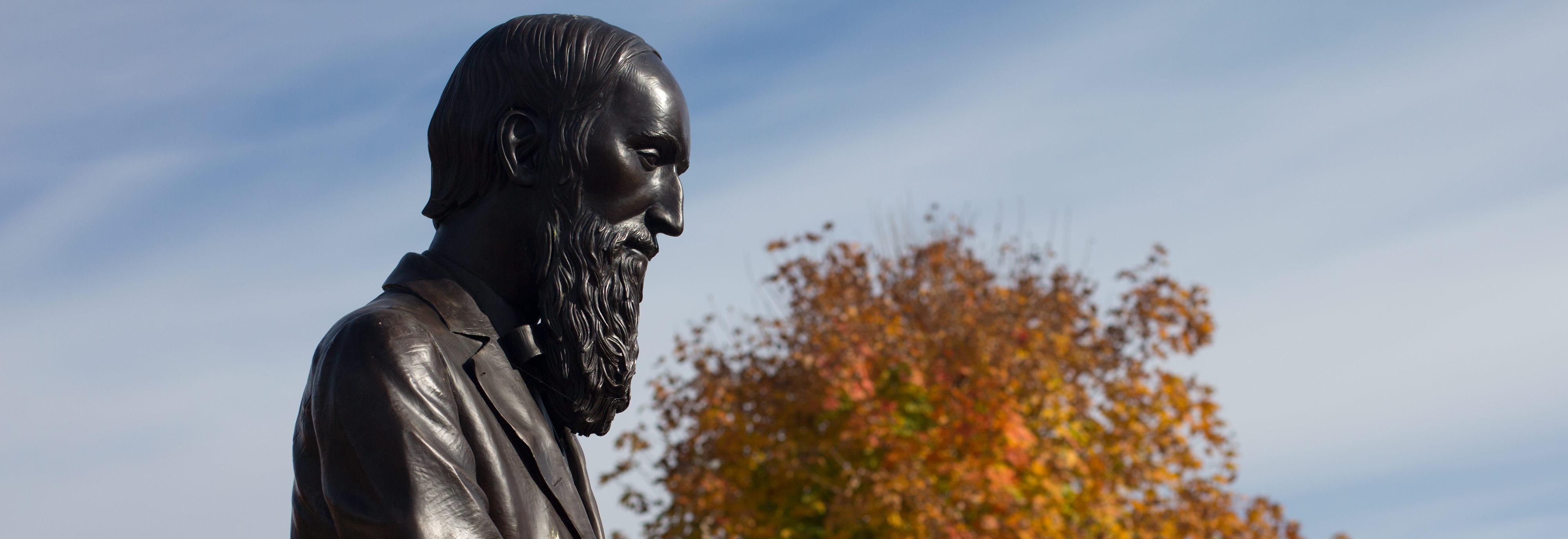 Changing leaves surround the statue of H.S. Lehr at Ohio Northern University